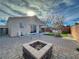 Landscaped backyard with fire pit and seating area at 8232 Carmen Blvd, Las Vegas, NV 89128