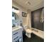 Modern bathroom with dark gray textured walls and a walk-in shower at 8232 Carmen Blvd, Las Vegas, NV 89128