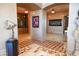 Elegant hallway with checkered floors and ornate artwork at 9101 Alta Dr # 1802, Las Vegas, NV 89145