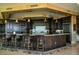 Luxury kitchen with dark wood cabinets and granite counters at 9101 Alta Dr # 1802, Las Vegas, NV 89145