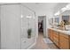 Bathroom with walk-in shower, double vanity and access to closet at 9124 Worsley Park Pl, Las Vegas, NV 89145