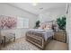 Spacious bedroom with large bed, window, and decorative accents at 9124 Worsley Park Pl, Las Vegas, NV 89145