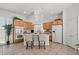 Spacious kitchen with island, wood cabinets, and breakfast bar at 9124 Worsley Park Pl, Las Vegas, NV 89145