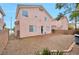 A spacious backyard with low maintenance landscaping and a view of neighboring homes at 9247 Tulip Trestle Ave, Las Vegas, NV 89148