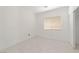 A bright bedroom with new tile flooring and neutral walls at 9247 Tulip Trestle Ave, Las Vegas, NV 89148