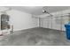 Garage with concrete flooring and white door at 9247 Tulip Trestle Ave, Las Vegas, NV 89148