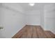Spacious walk-in closet with wooden floors and wire shelving for storage at 9247 Tulip Trestle Ave, Las Vegas, NV 89148