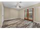 Bedroom with wood-look floors and French doors leading outside at 1012 Woodside Ct, Henderson, NV 89015