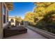 Relaxing balcony with outdoor daybed and treetop views at 12056 Royal Dolnoch Ct, Las Vegas, NV 89141