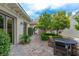 Charming courtyard with a stone table and chairs at 12056 Royal Dolnoch Ct, Las Vegas, NV 89141