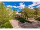 House with a paved driveway and lush green lawn at 12056 Royal Dolnoch Ct, Las Vegas, NV 89141