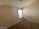 Well-lit bedroom featuring a window and carpet flooring at 1434 Summer Glow Ave, Henderson, NV 89012
