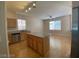 Open kitchen with island and hardwood floors at 1434 Summer Glow Ave, Henderson, NV 89012