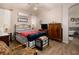 Charming bedroom featuring an antique armoire, wrought iron bed frame, and vintage decor at 206 Pebble Creek Hts, Mesquite, NV 89027