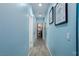 Light hallway with wood-look floors and access to bath at 206 Pebble Creek Hts, Mesquite, NV 89027