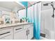 Bathroom with single vanity, shower, and blue accents at 2225 Chandler Ranch Pl, Laughlin, NV 89029
