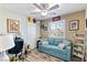 Bedroom with sofa, ceiling fan, and plenty of natural light at 2225 Chandler Ranch Pl, Laughlin, NV 89029