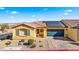 House exterior with solar panels and brick driveway at 2225 Chandler Ranch Pl, Laughlin, NV 89029
