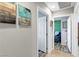 Clean hallway with light walls, white doors, and wood-look flooring at 2225 Chandler Ranch Pl, Laughlin, NV 89029