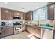 Kitchen with stainless steel appliances and granite countertops at 2225 Chandler Ranch Pl, Laughlin, NV 89029