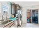 Kitchen with stainless steel appliances and access to backyard at 2225 Chandler Ranch Pl, Laughlin, NV 89029