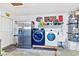 Garage laundry area with washer, dryer, and fridge at 2225 Chandler Ranch Pl, Laughlin, NV 89029