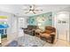 Relaxing living room with two brown recliners, a teal accent wall, and a ceiling fan at 2225 Chandler Ranch Pl, Laughlin, NV 89029