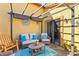 Covered patio with seating area and adjacent door at 2225 Chandler Ranch Pl, Laughlin, NV 89029