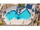Community pool with surrounding patio and palms at 2225 Chandler Ranch Pl, Laughlin, NV 89029