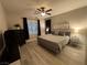 Spacious bedroom with king-size bed, large window, and ample closet space at 2828 Shadows Edge Ct, Henderson, NV 89052