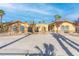 Front view of a single-story house with a fountain and palm trees at 2920 S Tioga Way, Las Vegas, NV 89117