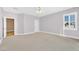 Large bedroom with ample natural light, neutral walls, and additional access to another room at 31 Castle Creek Ct, Las Vegas, NV 89148