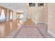 Bright entryway with hardwood floors, a staircase, and tiled flooring at 31 Castle Creek Ct, Las Vegas, NV 89148