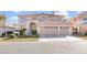 Two-story house with a three-car garage and manicured lawn at 31 Castle Creek Ct, Las Vegas, NV 89148
