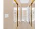 Bright hallway with mirrored closets and access to bedrooms at 31 Castle Creek Ct, Las Vegas, NV 89148