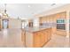 Open kitchen with island and stainless steel appliances at 31 Castle Creek Ct, Las Vegas, NV 89148