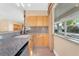 Kitchen wet bar with granite countertop and sink at 31 Castle Creek Ct, Las Vegas, NV 89148