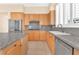 Kitchen with granite counters, stainless steel appliances, and light wood cabinets at 31 Castle Creek Ct, Las Vegas, NV 89148