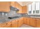 Bright kitchen with granite countertops and light wood cabinets at 31 Castle Creek Ct, Las Vegas, NV 89148