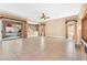 Large living room with tile floors and ceiling fan at 31 Castle Creek Ct, Las Vegas, NV 89148
