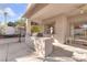 Outdoor patio with built-in grill, ceiling fan, and seating area at 31 Castle Creek Ct, Las Vegas, NV 89148