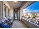 Relaxing balcony with patio furniture and mountain views at 351 Elder View Dr, Las Vegas, NV 89138