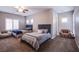 Spacious bedroom with two twin beds and a comfortable chair at 351 Elder View Dr, Las Vegas, NV 89138