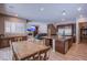 Open concept kitchen with breakfast bar and views to living room at 351 Elder View Dr, Las Vegas, NV 89138