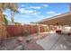 Spacious backyard with covered patio and wood accents at 3829 Delaware Ln, Las Vegas, NV 89169
