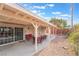Covered patio with seating area and desert landscaping at 3829 Delaware Ln, Las Vegas, NV 89169