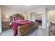 Bright bedroom with a large bed and mirrored closet doors at 3829 Delaware Ln, Las Vegas, NV 89169