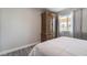 Simple bedroom with a queen bed and an armoire at 3829 Delaware Ln, Las Vegas, NV 89169