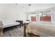 Spacious bedroom with two beds and backyard access at 3829 Delaware Ln, Las Vegas, NV 89169