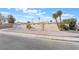 Single story home with attached garage and palm trees at 3829 Delaware Ln, Las Vegas, NV 89169